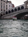 panoramic view of a Venice canal with water taxi