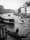 panoramic view of a Venice canal with water taxi and gondola