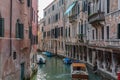 Panoramic view of Venice narrow canal with historical buildings and boat Royalty Free Stock Photo