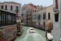 Panoramic view of Venice narrow canal with historical buildings and boat Royalty Free Stock Photo