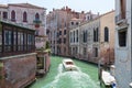 Panoramic view of Venice narrow canal with historical buildings and boat Royalty Free Stock Photo