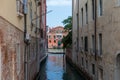 Panoramic view of Venice narrow canal with historical buildings and boat Royalty Free Stock Photo