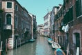 Panoramic view of Venice narrow canal with historical buildings and boat Royalty Free Stock Photo