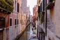 Panoramic view of Venice narrow canal with historical buildings and boat Royalty Free Stock Photo