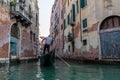 Panoramic view of Venice narrow canal with historical buildings and gondolas