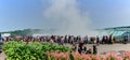 Wide angle view of tourists looking at the Niagara Falls in Ontario, Canada Royalty Free Stock Photo