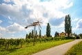 Panoramic view at vineyards with Klapotetz pinwheel before harvest, South Styrian wine route, Austria