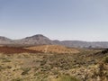 Panoramic view of volcanic lanscape in front of the ocean from the peak of mountain Teide, Tenerife