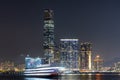 Panoramic view of West Kowloon and Victoria Harbour in Hong Kong at night. Royalty Free Stock Photo