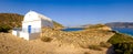 Panoramic view of white chapel at beautiful ocean coastline, Greece