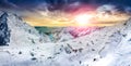 Panoramic view of white winter mountains at colorful sunset Royalty Free Stock Photo