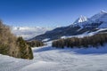 Panoramic view of wide and groomed ski piste in resort of Pila in Valle d`Aosta, Italy during winter Royalty Free Stock Photo