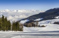 Panoramic view of wide and groomed ski piste in resort of Pila in Valle d`Aosta, Italy during winter Royalty Free Stock Photo