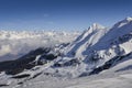 Panoramic view of wide and groomed ski piste in resort of Pila in Valle d`Aosta, Italy during winter Royalty Free Stock Photo