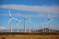 Panoramic view of wind farm or a wind park, with high wind turbines for generation electricity . Generative AI Royalty Free Stock Photo