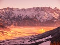 Panoramic view of winter mountains. Alpine peaks and valley in morning fog Royalty Free Stock Photo