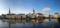 Panoramic view: Wonderful day for sightseeing: Limmat river promenade in Zurich, Switzerland