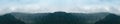 Panoramic view of wooded mountains, hills and forest Royalty Free Stock Photo