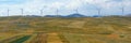 Panoramic view of yellow fields with windmills. Montenegro, Niksic, Krnovo wind park