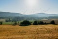 Panoramic view of yellow and green fields and hills in background Royalty Free Stock Photo