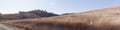 panoramic views of dry grassy drought stricken farm