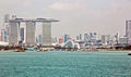 Panoramic views of the port and the city of Singapore during day and night. Kind of cargo and merchant vessels anchored. Royalty Free Stock Photo