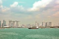 Panoramic views of the port and the city of Singapore during day and night. Kind of cargo and merchant vessels anchored. Royalty Free Stock Photo