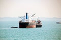 Panoramic views of the port and the city of Singapore during day and night. Kind of cargo and merchant vessels anchored. Royalty Free Stock Photo