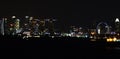 Panoramic views of the port and the city of Singapore during day and night. Kind of cargo and merchant vessels anchored. Royalty Free Stock Photo