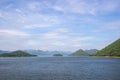 Panoramic views of reservoir,hills and blue sky at Kaeng Krachan Dam,Kaeng Krachan National Park,Phetchaburi Province, Thailand. Royalty Free Stock Photo