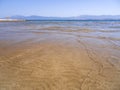 Panoramic views of the sandy beach,  mountains  the island of Evia on Liani Ammos beach in Halkida, Greece on a Sunny summer day Royalty Free Stock Photo