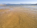 Panoramic views of the sandy beach,  mountains  the island of Evia on Liani Ammos beach in Halkida, Greece on a Sunny summer day Royalty Free Stock Photo