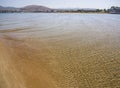 Panoramic views of the sandy beach,  mountains  the island of Evia on Liani Ammos beach in Halkida, Greece on a Sunny summer day Royalty Free Stock Photo