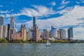 Panoramic views of the skyline by boat during the day.