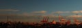 panoramic views of tall port shipping cranes standing tall loading a ship in port with shipping containers at Port Melbourne, with