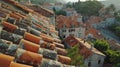 Panoramic vista of historic town with ancient dwellings and traditional red tiled roofs