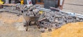 Panoramic wheelbarrow with paving stones road construction