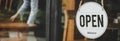 Panoramic wide banner. coffee cafe shop text on vintage sign board hanging on glass door in cafe shop open after coronavirus quara