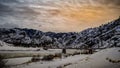 Panoramic winter landscape of a frozen bridge over the Missouri river captured at sunset Royalty Free Stock Photo