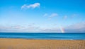 Winter view of Baltic sea with beach and rainbow over maritime horizon offshore Gdynia Orlowo district of Tricity in Poland