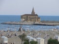 A panoramic view of madonna dell angelo church and lighthouse bell tower at caorle venice italy city beach