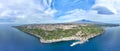 Panoramica aerea sulla cittÃ  di Acireale, la Timpa e Santa Maria la Scala con il vulcano Etna da sfondo con mare blu