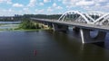 Panoraming Shot of the Darnytsky Bridge across the river Dnipro in Kyiv in the afternoon sunny day