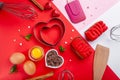 Pans hearts mold, whisk, eggs, wooden spatula and grated chocolate. Ingredients to making festive cake. Valentines Day bakeware