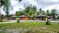 A colorful tourist, vacation houses beside the road near the beach.