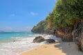 Pantai Gunung Payung beach with fine golden sand, Bali. Turquoise blue water turns into sea foam as the waves break against rocky