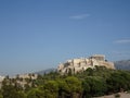 The pantheon of Athens seen from a park on a sunny day