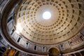 Pantheon entrance and roof of a large historic building with a large hole in the roof