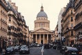 Pantheon Monument end of a street in Paris, France at sunset