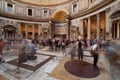 Inside Pantheon in Rome with tourist walking